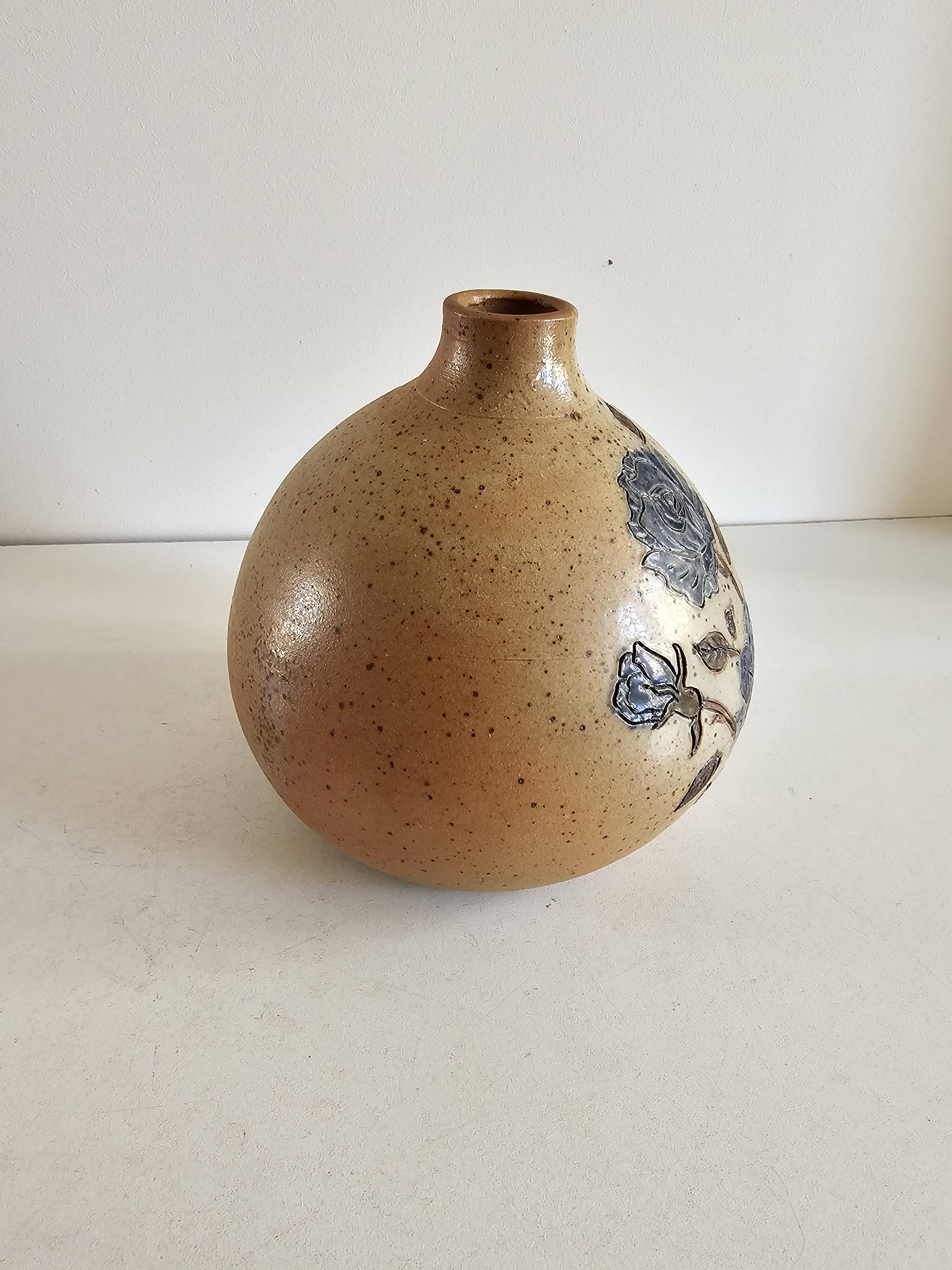 Ceramic lamp base with floral pattern, signed.