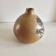 Ceramic lamp base with floral pattern, signed.