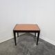 Vintage wooden ottoman from the 1940s with a silk top and studded trim.