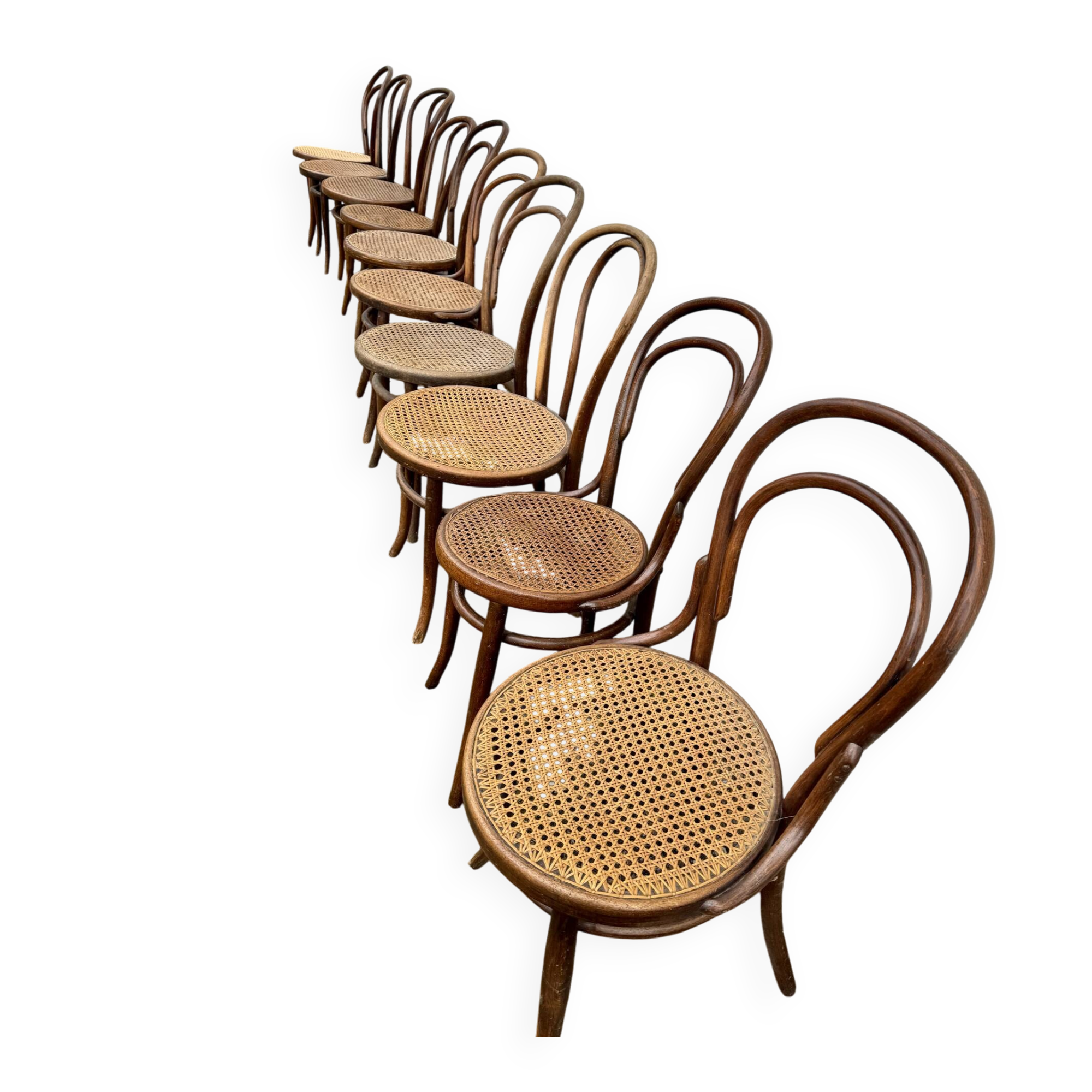 Set of 10 bentwood bistro chairs with cane seat.