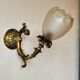 Bronze wall light with opaque glass tulip