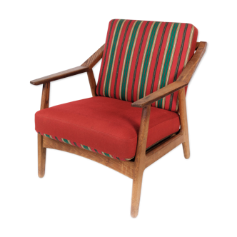 Armchair in oak and upholstered with red fabric, designed by H. Brockmann Pedersen, 1960s