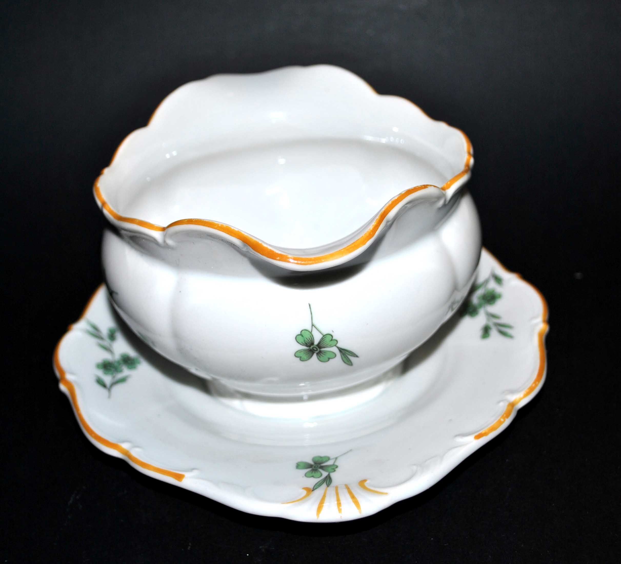 Vintage porcelain pouring saucière decorated with green clover