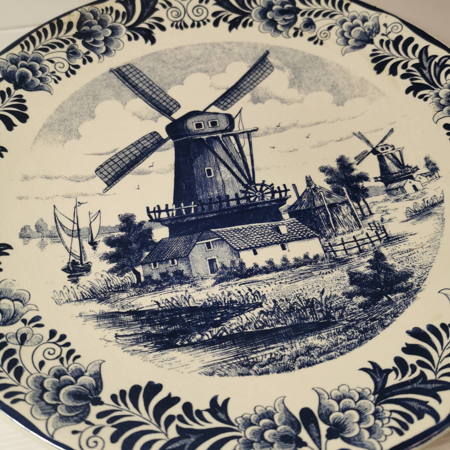Delft earthenware dish decorated with a mill late 19th early 20th century diameter 39 cm