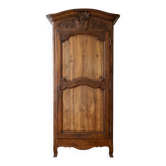 Antique carved wooden wardrobe with cornice.