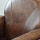 Set of 2 vintage sheepskin armchairs with a characterful appearance