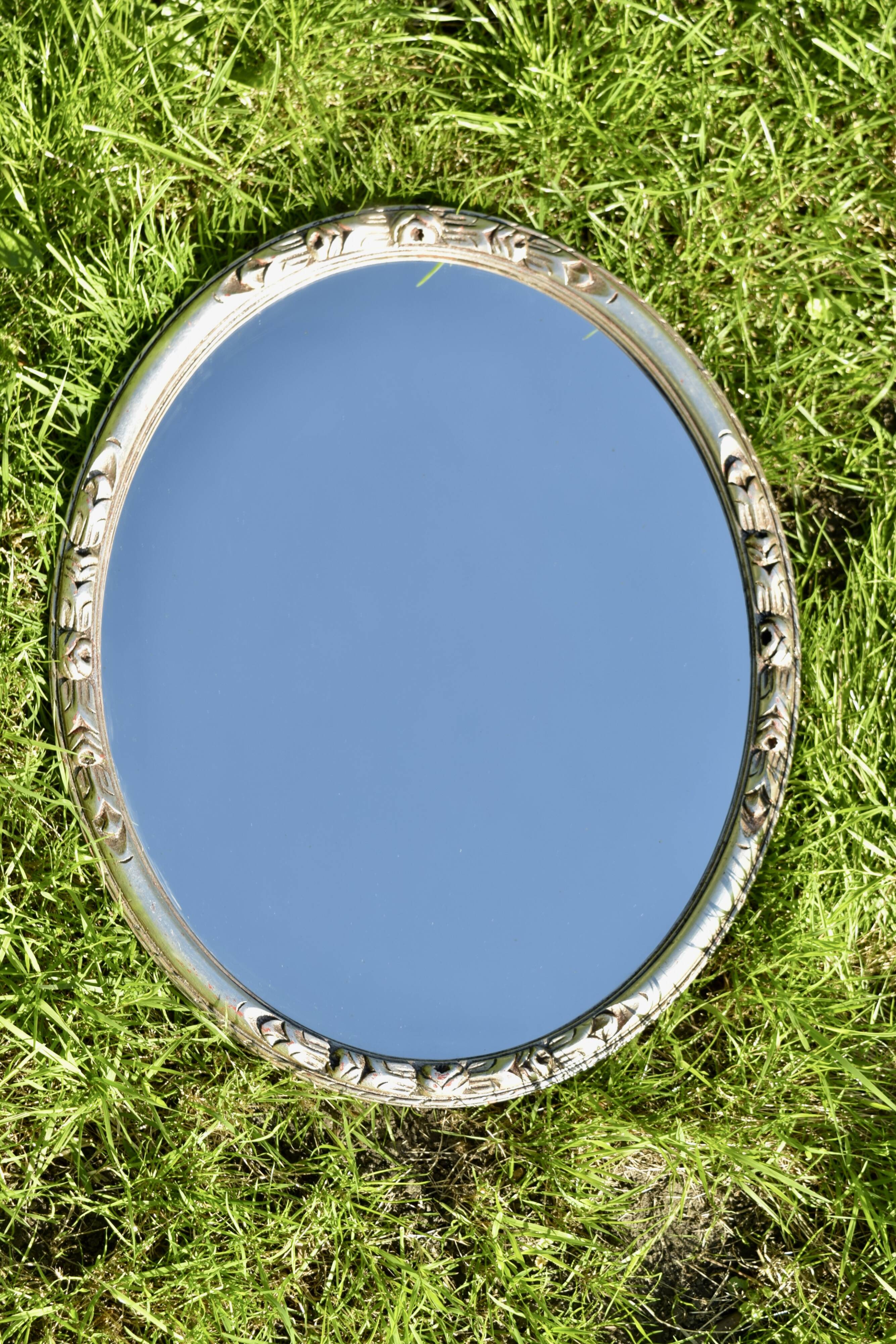 Old large oval wall mirror in silver painted wood - 1950s