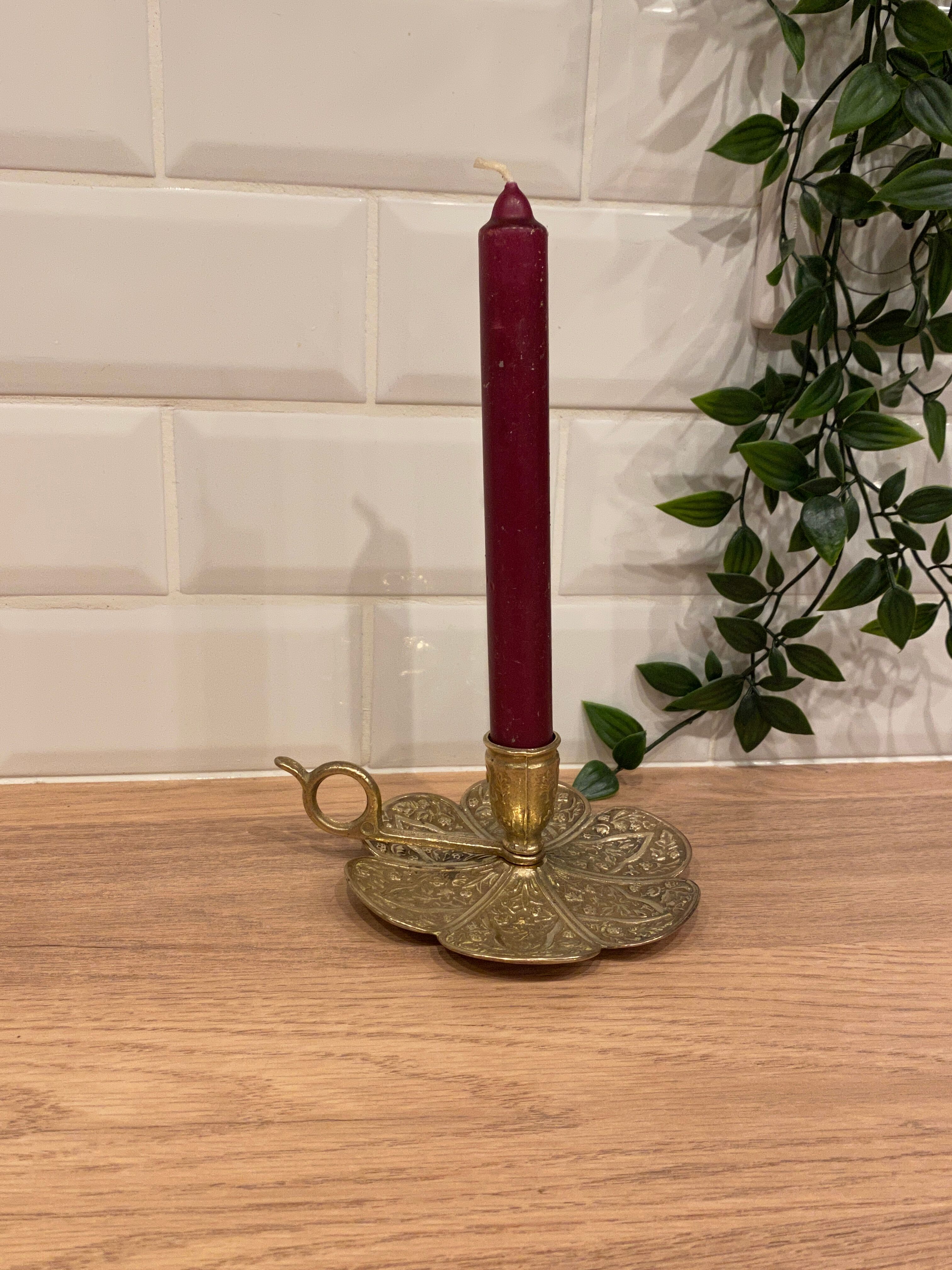 Brass candle holder on frame