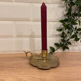 Brass candle holder on frame