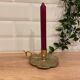 Brass candle holder on frame