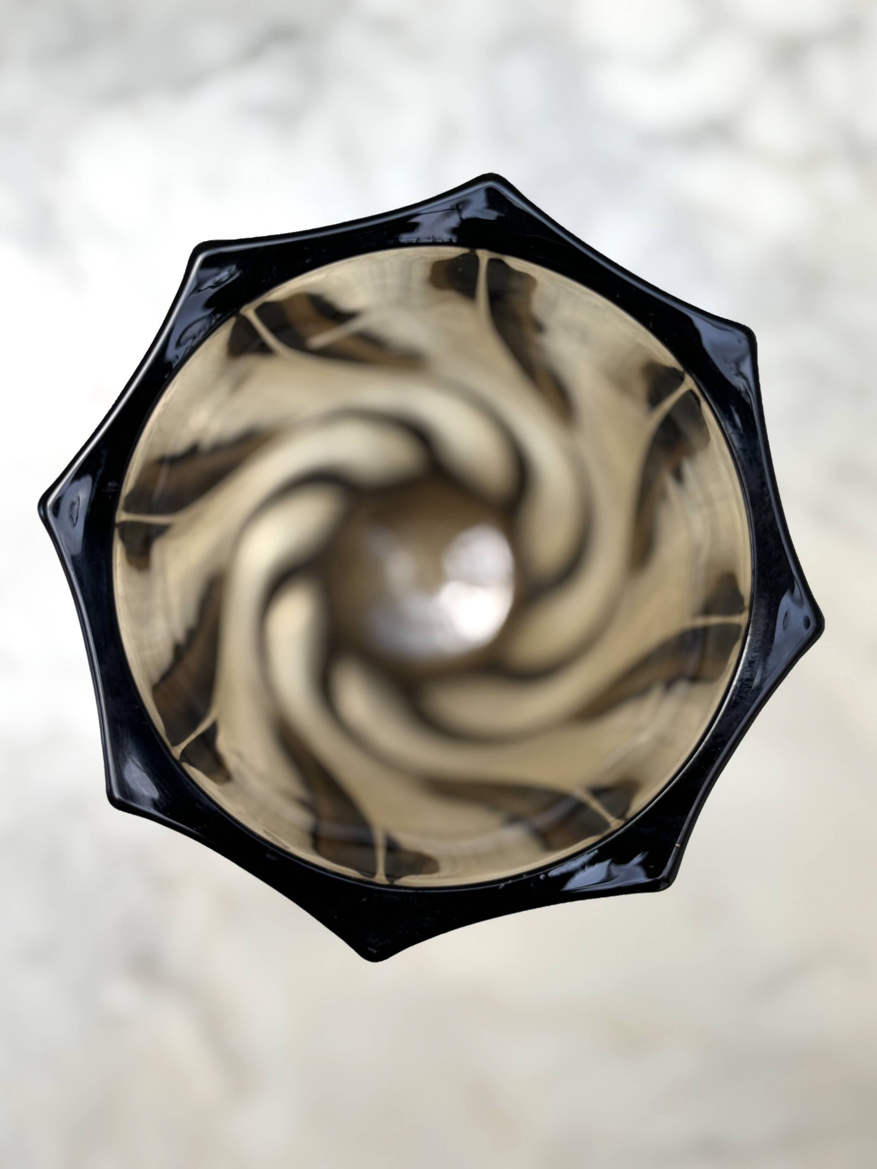 Small translucent dark brown twisted glass vase