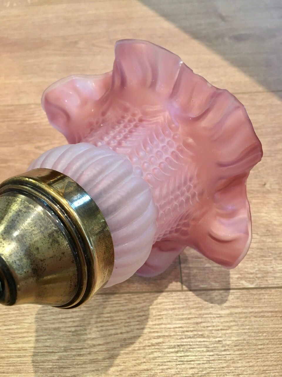 Pair of brass sconces and pink glass