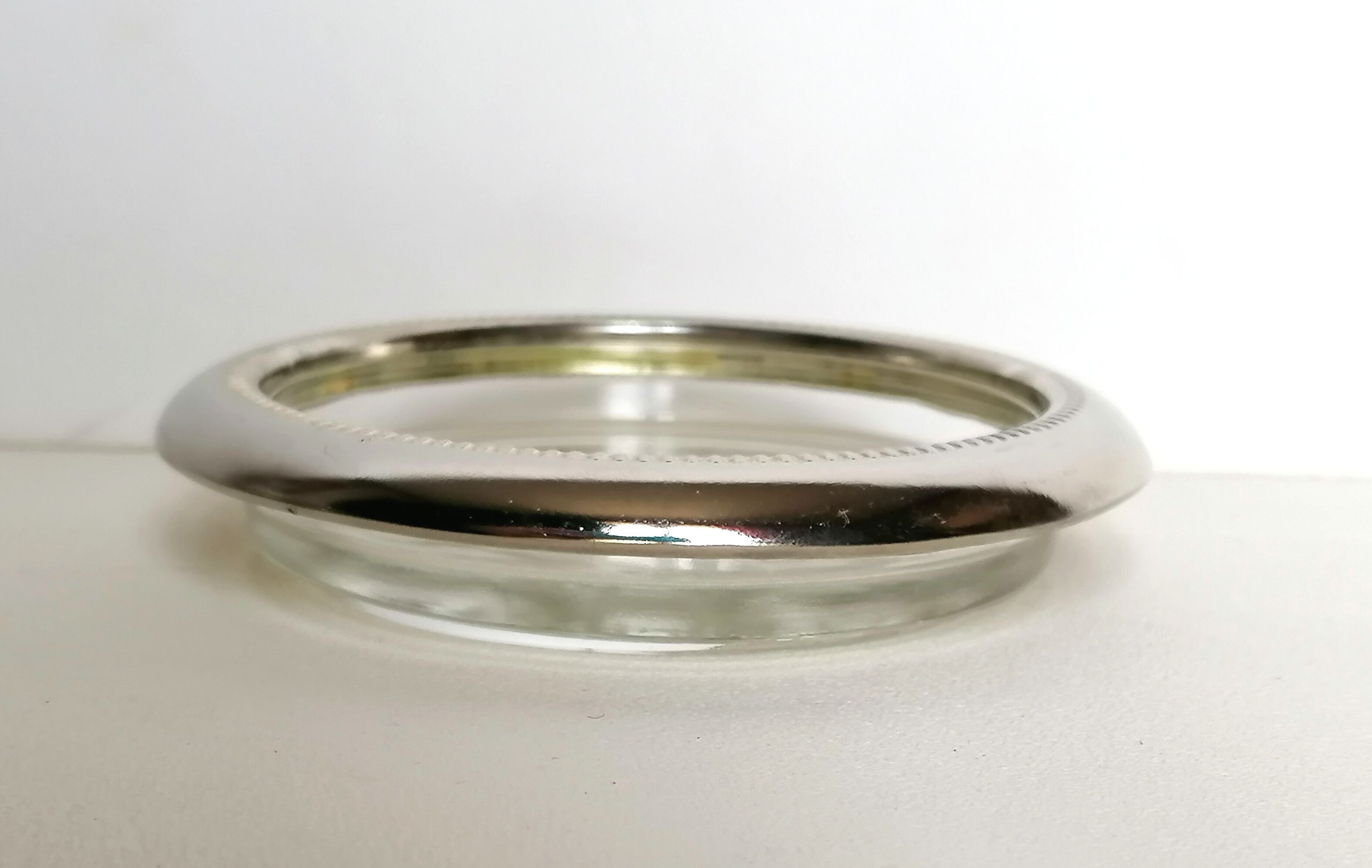 Three under silver-plated bottles