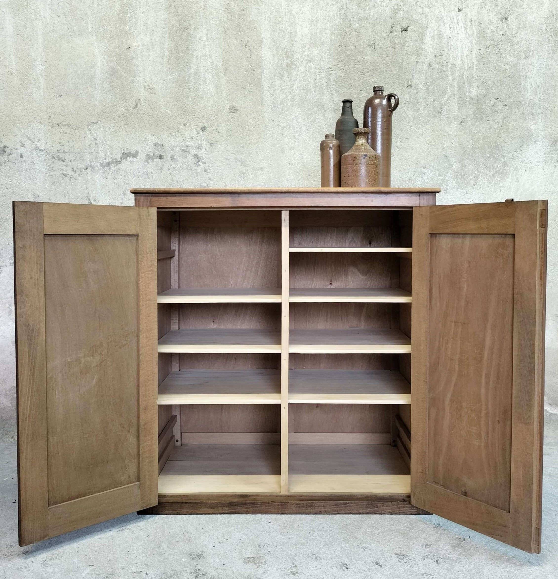Small wooden sideboard with two doors.