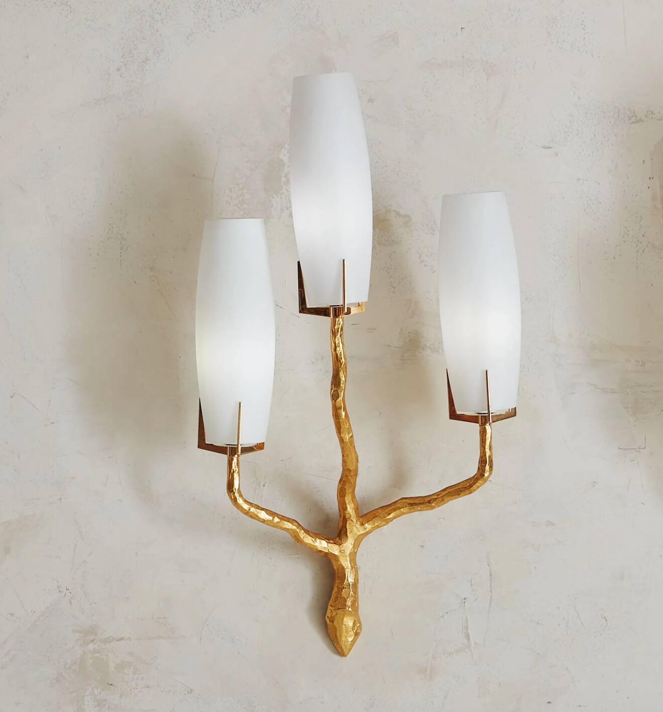Pair of wall lights by Maison Arlus by Felix Agostini in bronze.