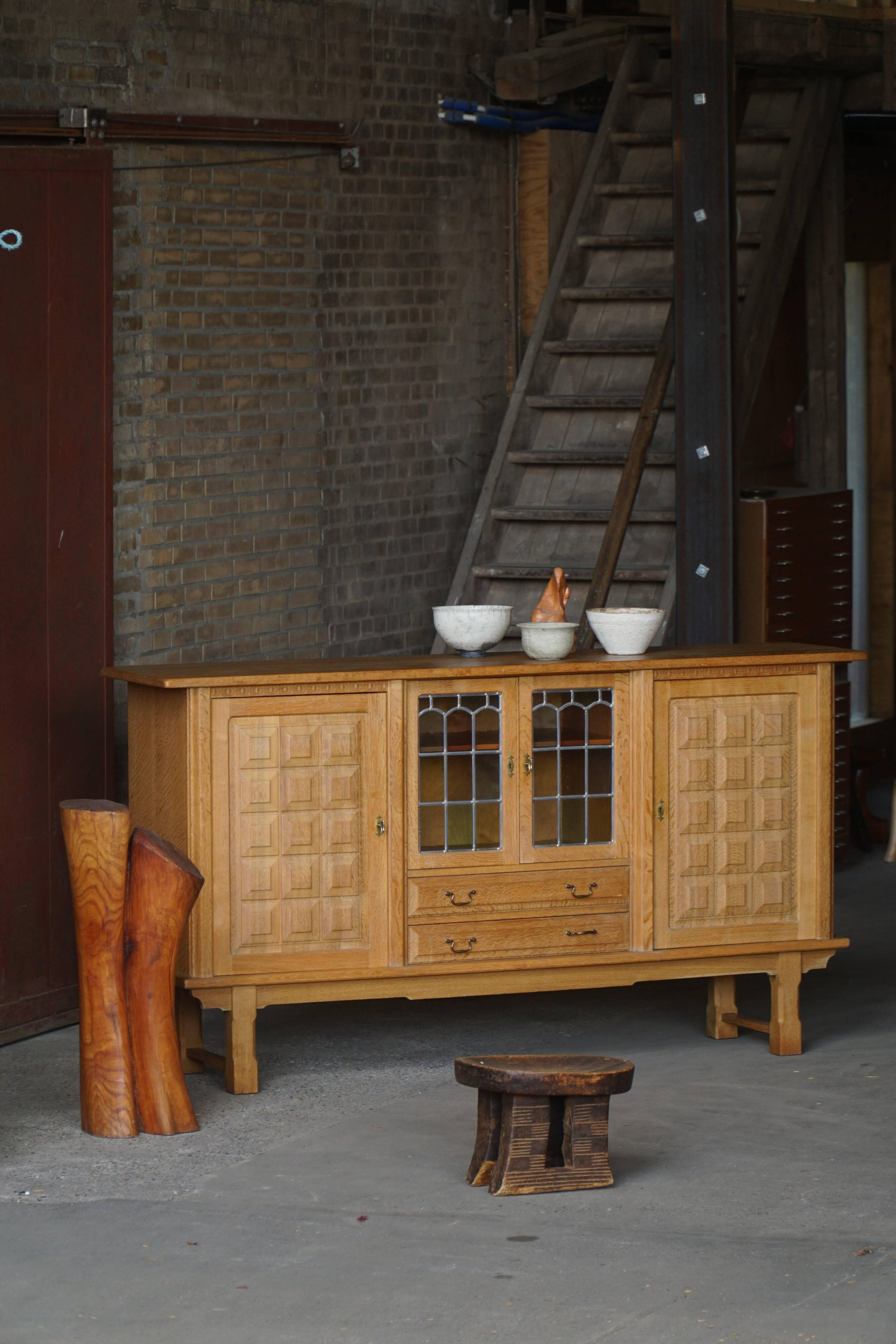 Danish oak buffet with lead glass doors, Henning Kjærnulf, Denmark, 1960s