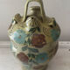 Mediterranean ceramic jug with floral decoration.