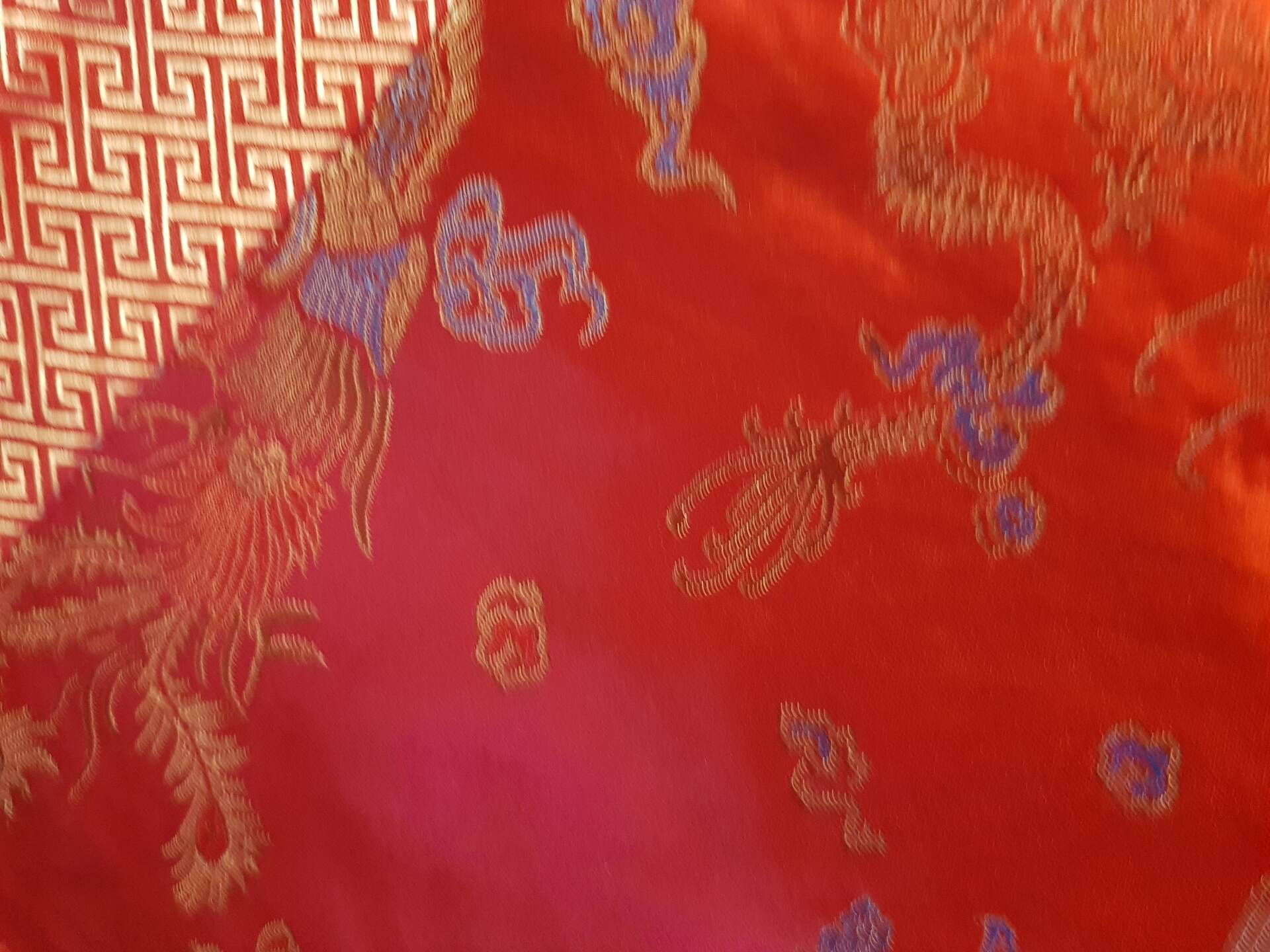Set of 6 small table napkins in red brocade.