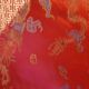 Set of 6 small table napkins in red brocade.