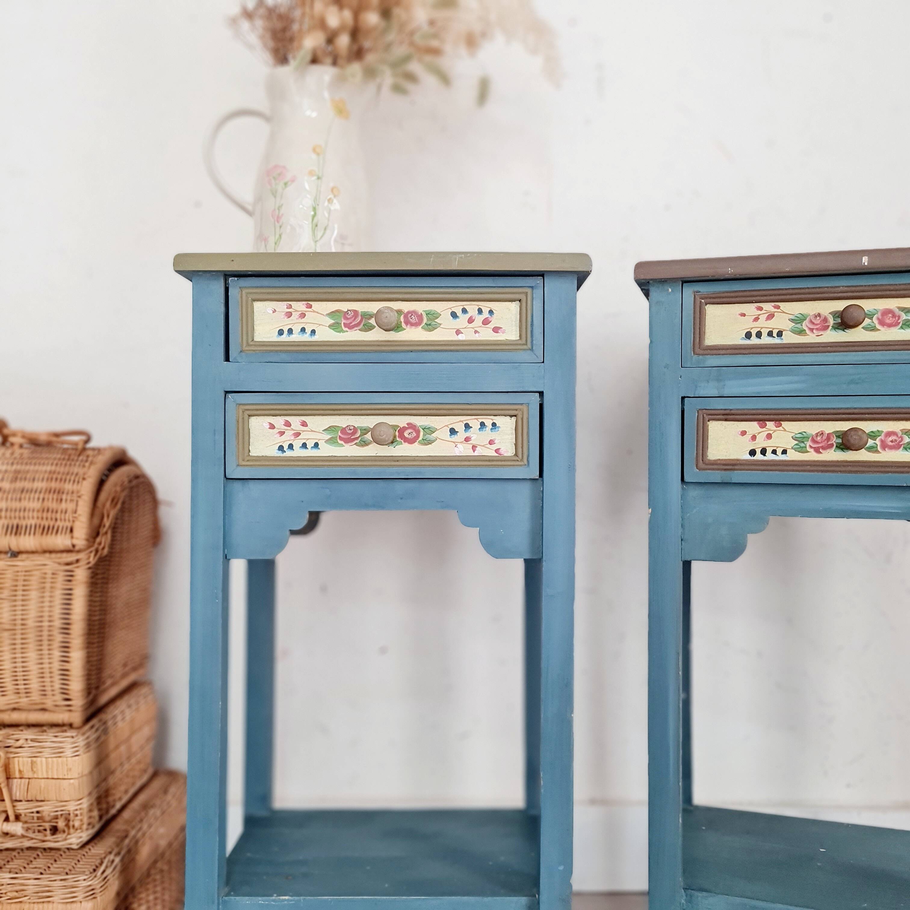 Blue wooden bedside tables with floral patterns