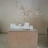 Vase architecture in raw sandstone.
