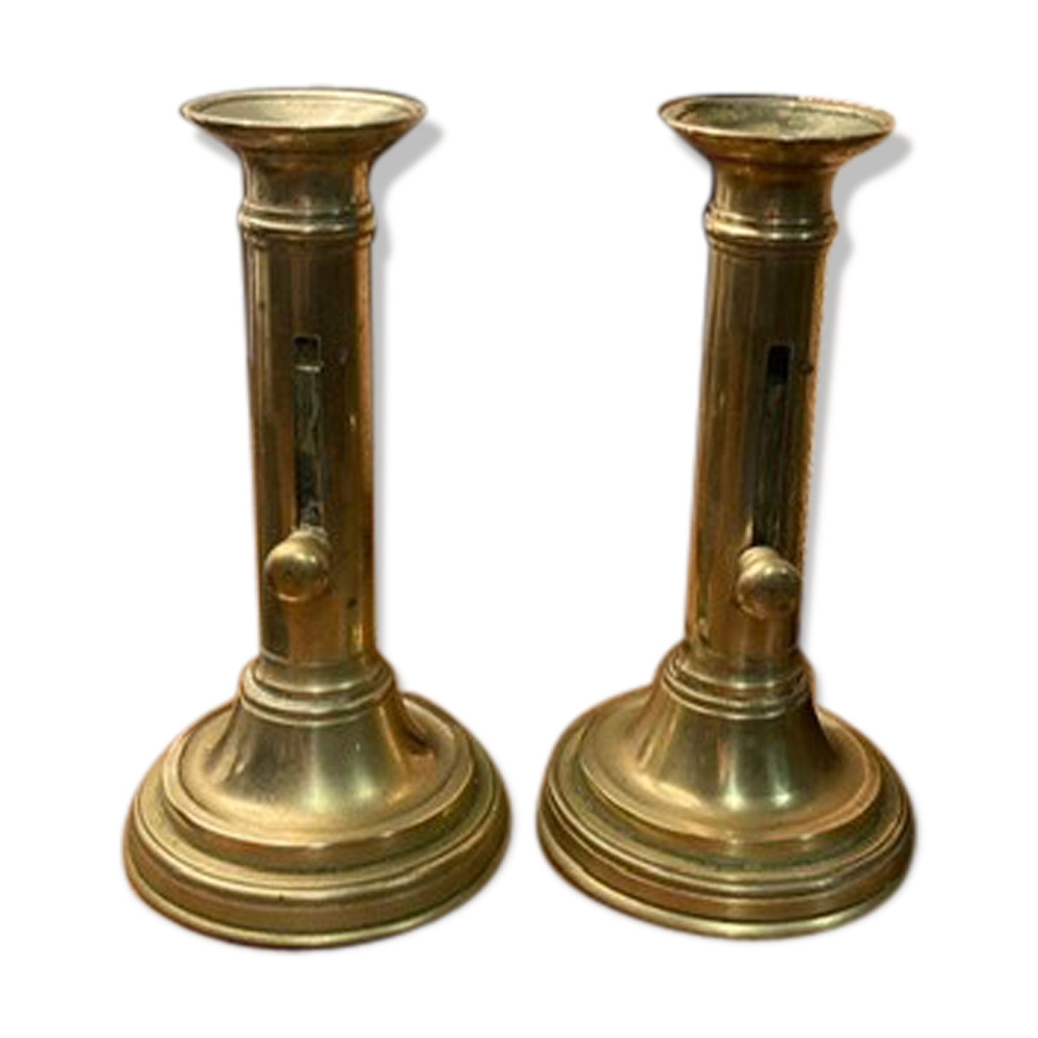 Pair of 19th-century brass pusher candlesticks