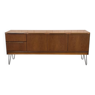 1970s English enfilade in teak with splayed legs.