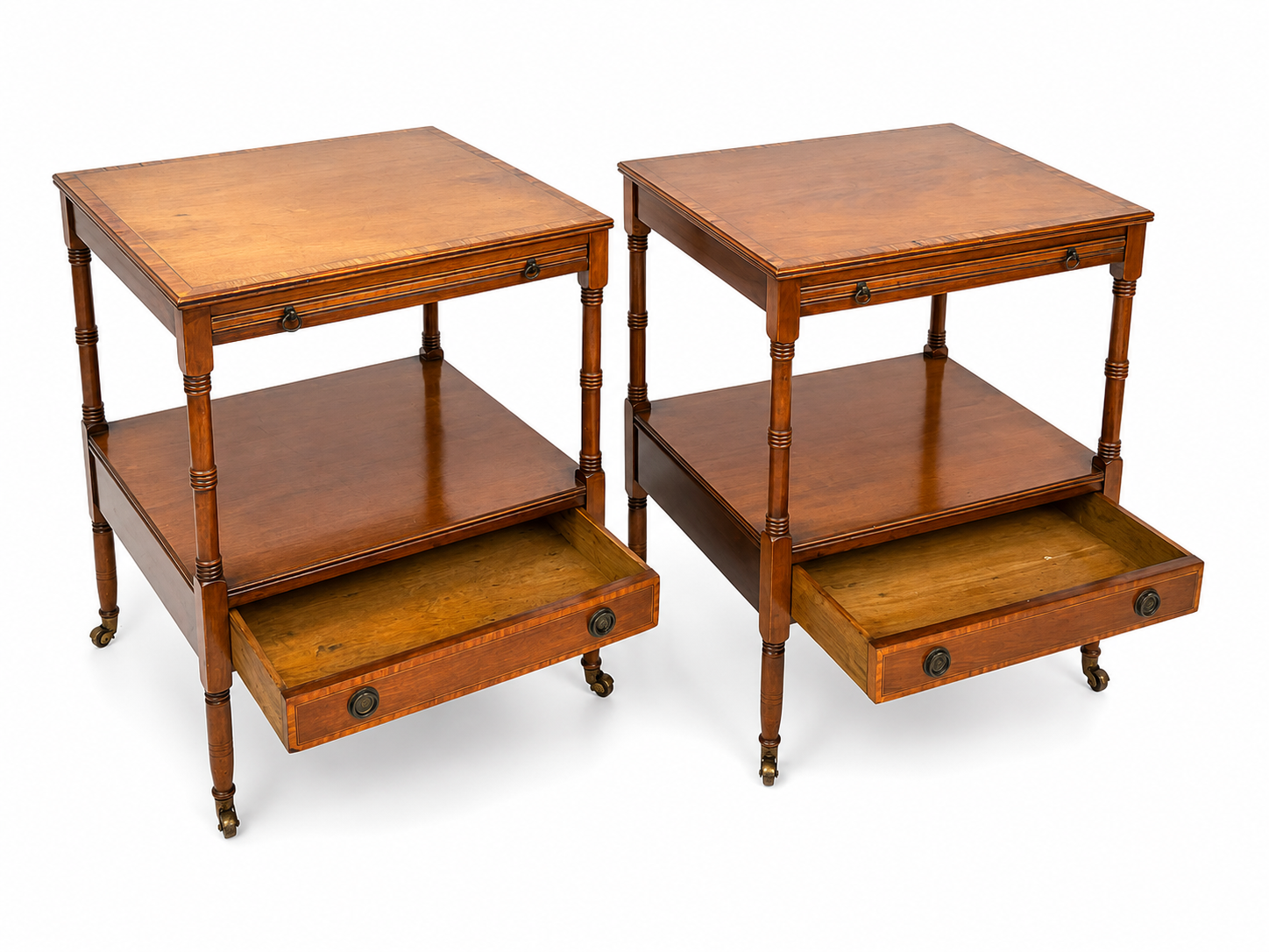 Pair of English mahogany side tables with sliding shelf.