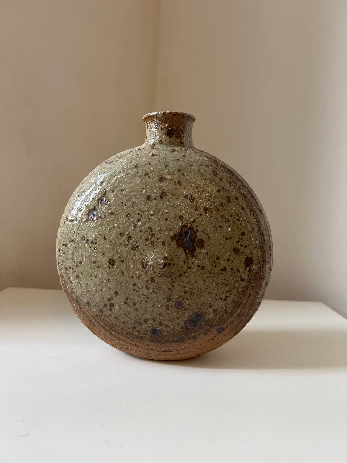 Vintage round, flat-bottomed stoneware bud vase