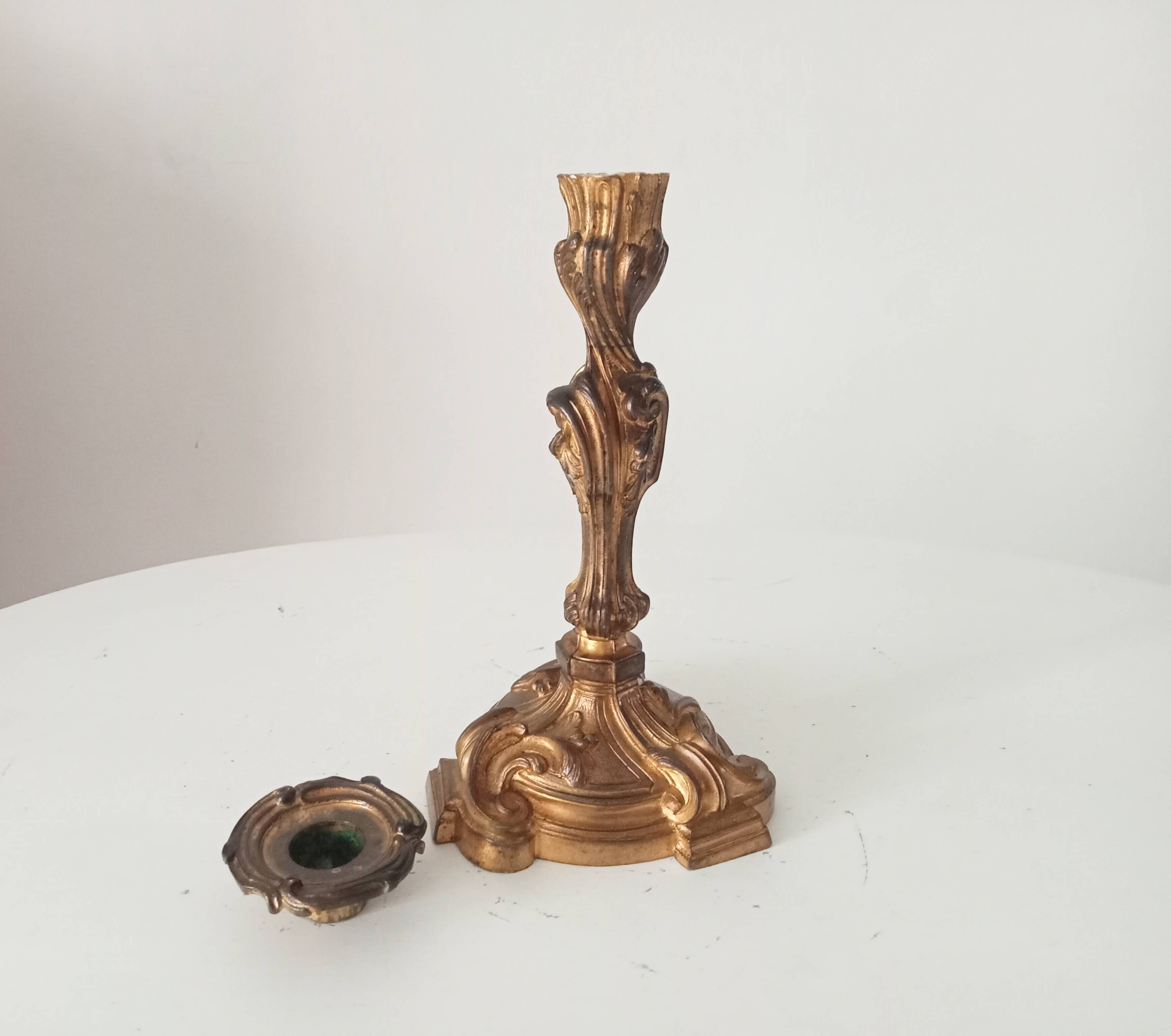 Antique 19th-century solid gilded bronze candlestick in the Louis XV style.