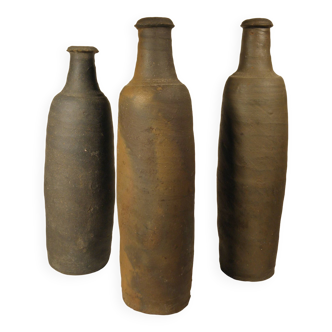 Trio of ancient stoneware bottles