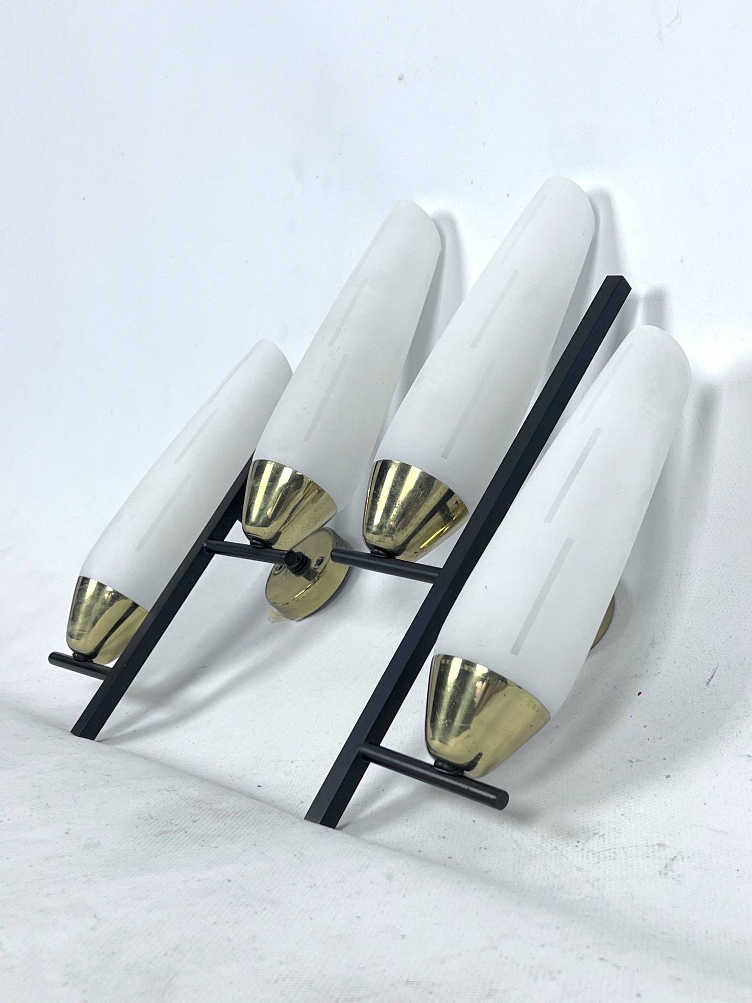 Mid-Century pair of double lights sconces in brass and opaline glass. Italy 1950s