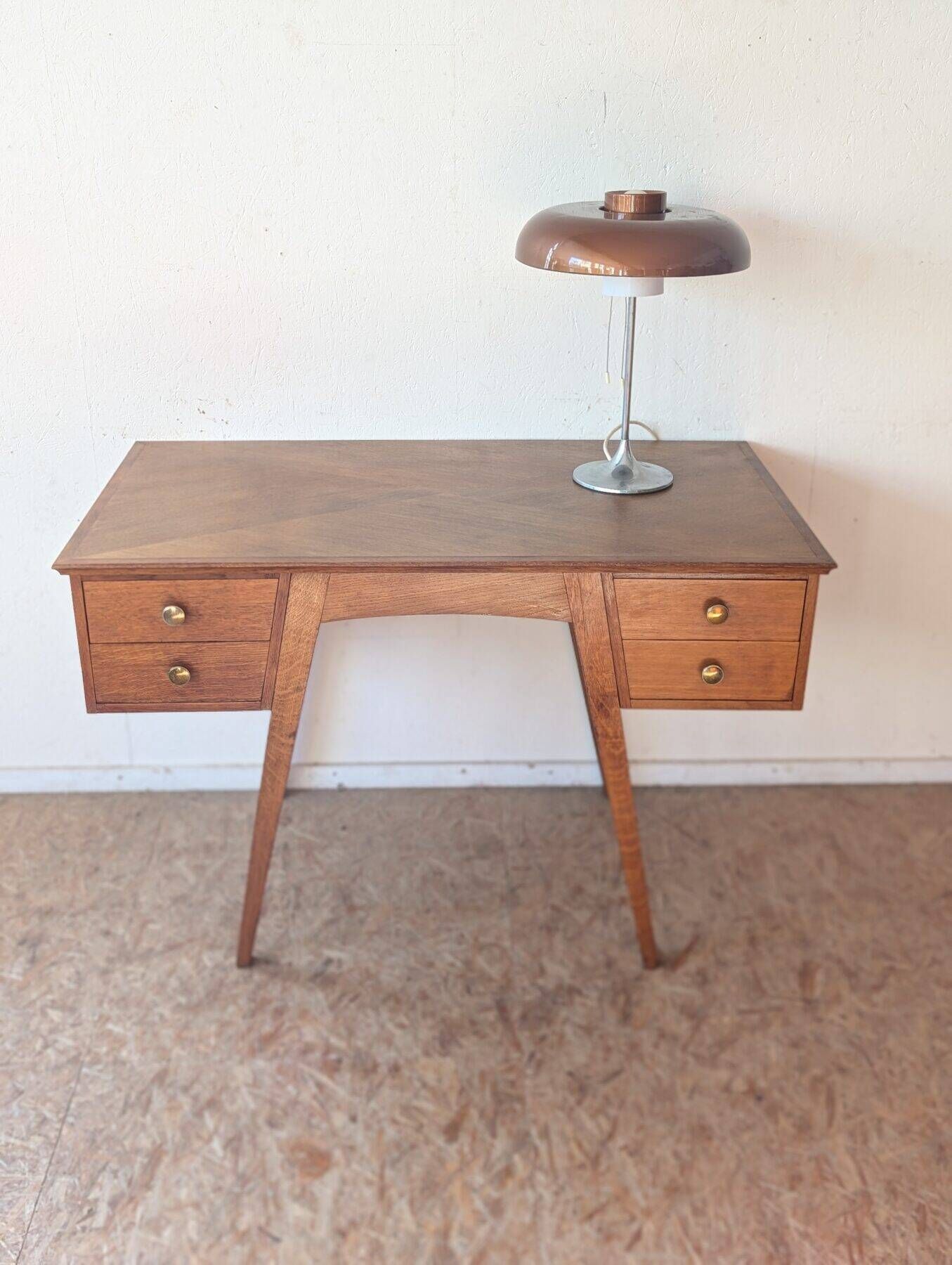 1950s oak double-sided desk with compass legs.