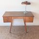 1950s oak double-sided desk with compass legs.