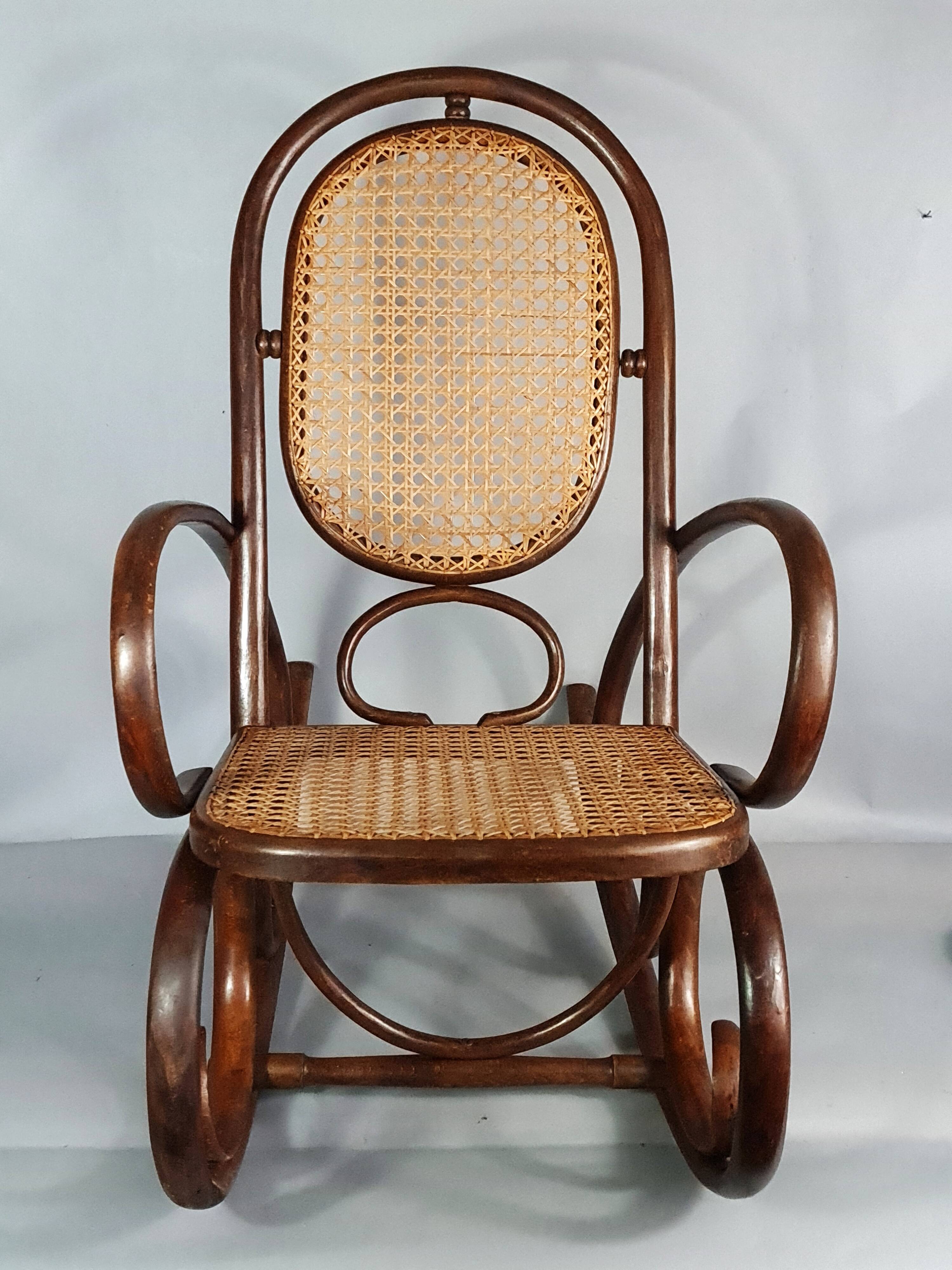 Vintage curved wood rocking chair for children with recent caning model D912.