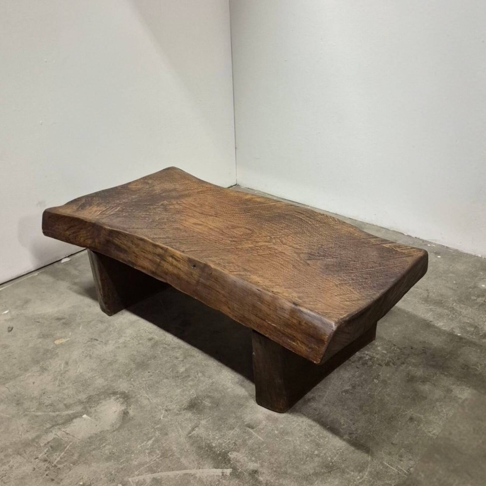 Rustic solid oak coffee table with a one piece top, France 1950s