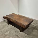 Rustic solid oak coffee table with a one piece top, France 1950s