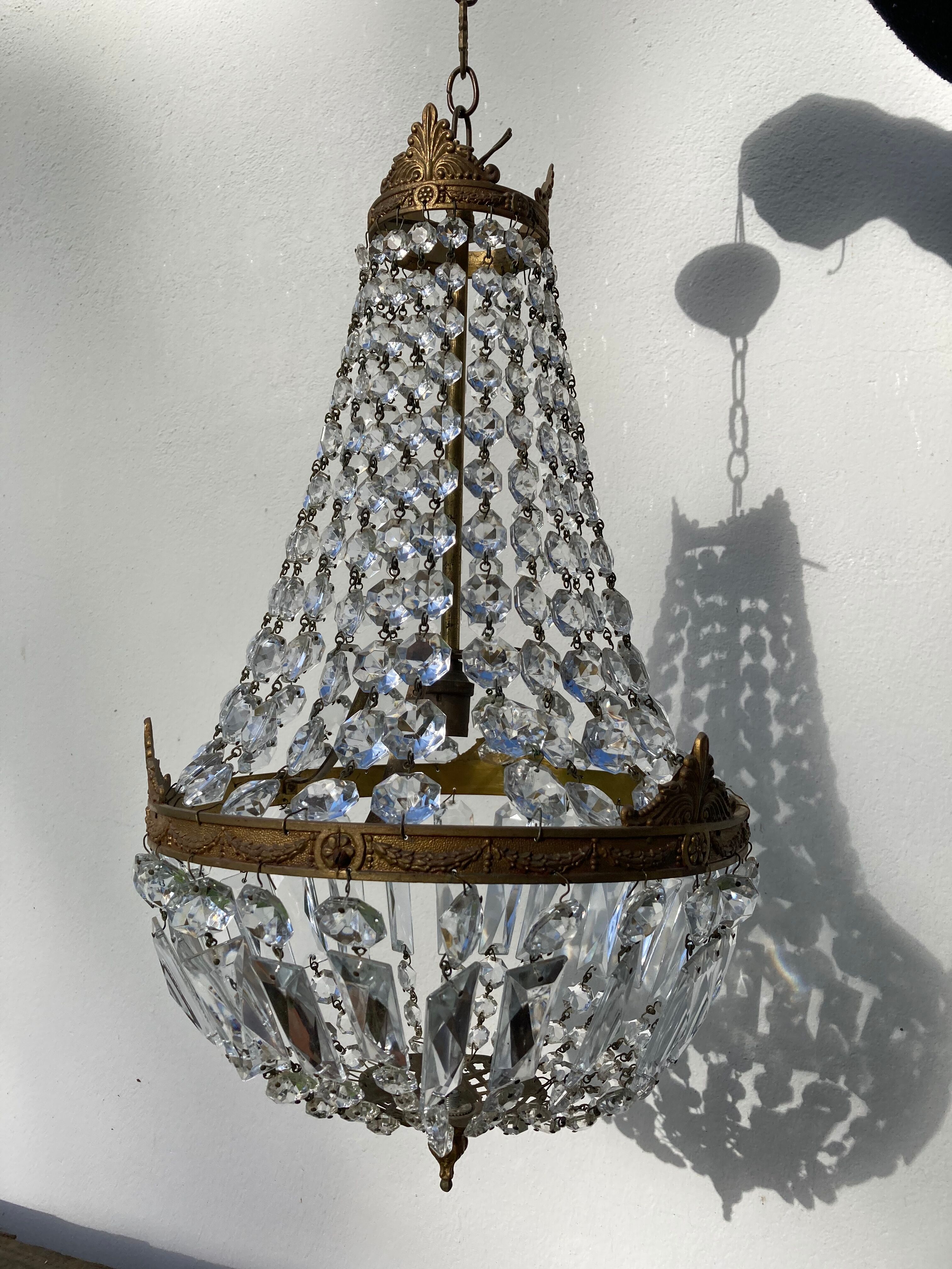 Balloon chandelier with glass crystal and brass tassels in empire style