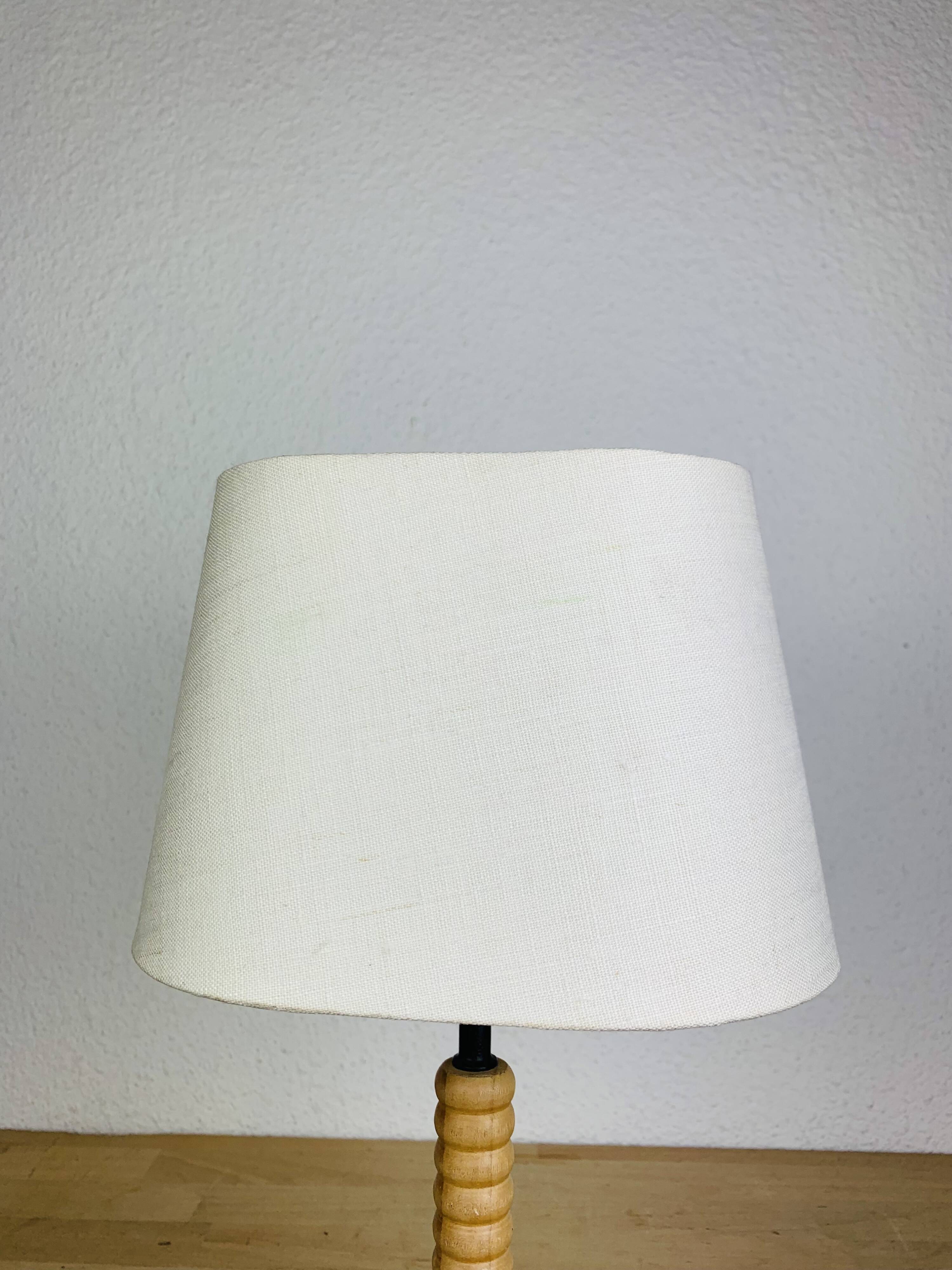 Wrought iron and wood tripod lamp