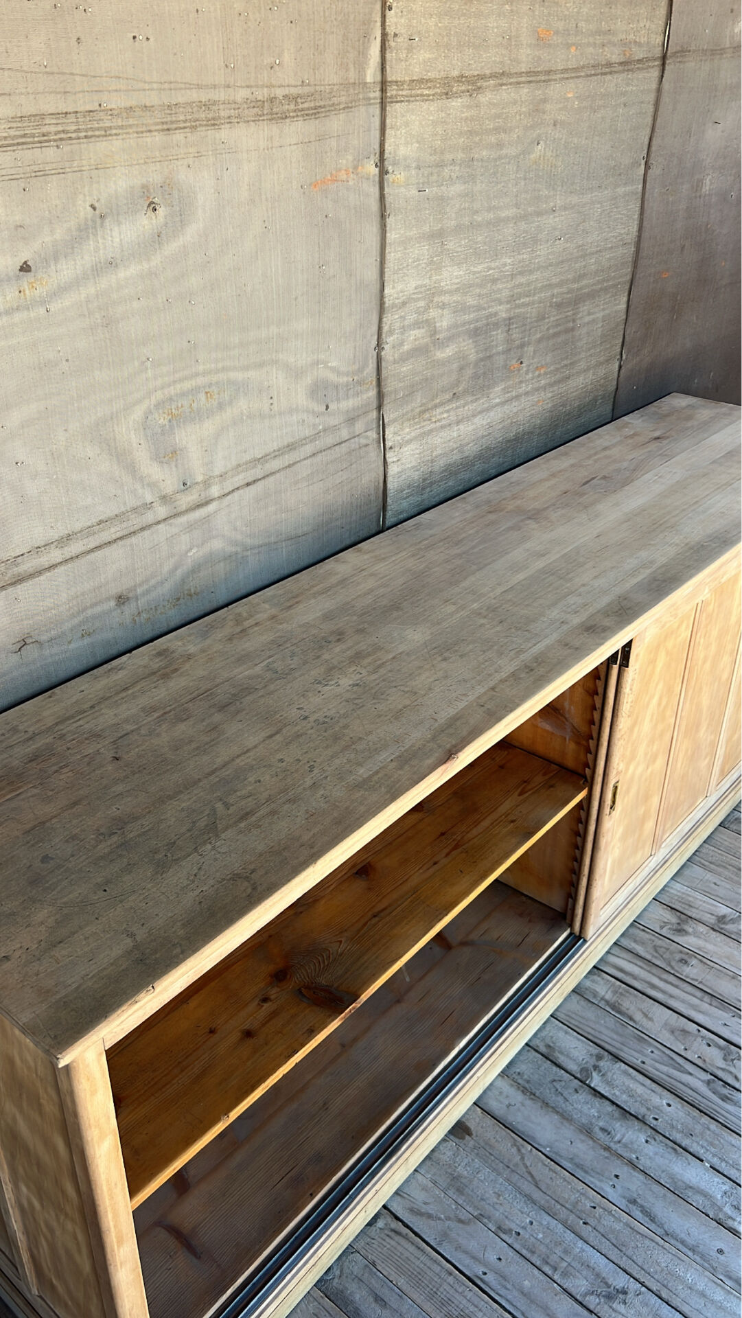 Old counter with sliding doors in raw wood
