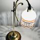 Old lamp adjustable on foot tulip golden brass.