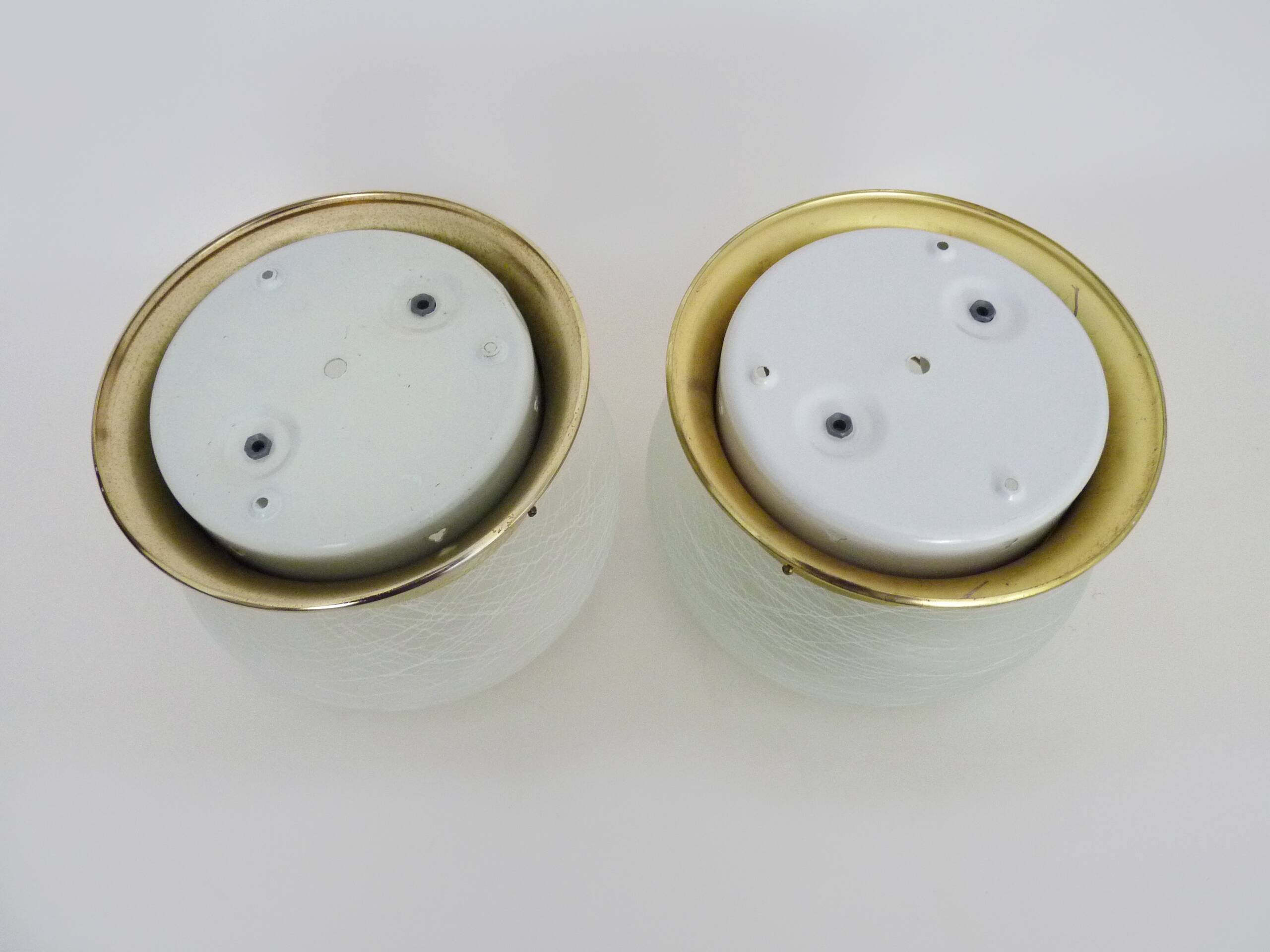 Pair of wall or ceiling lights with white-edged globe. 80 years