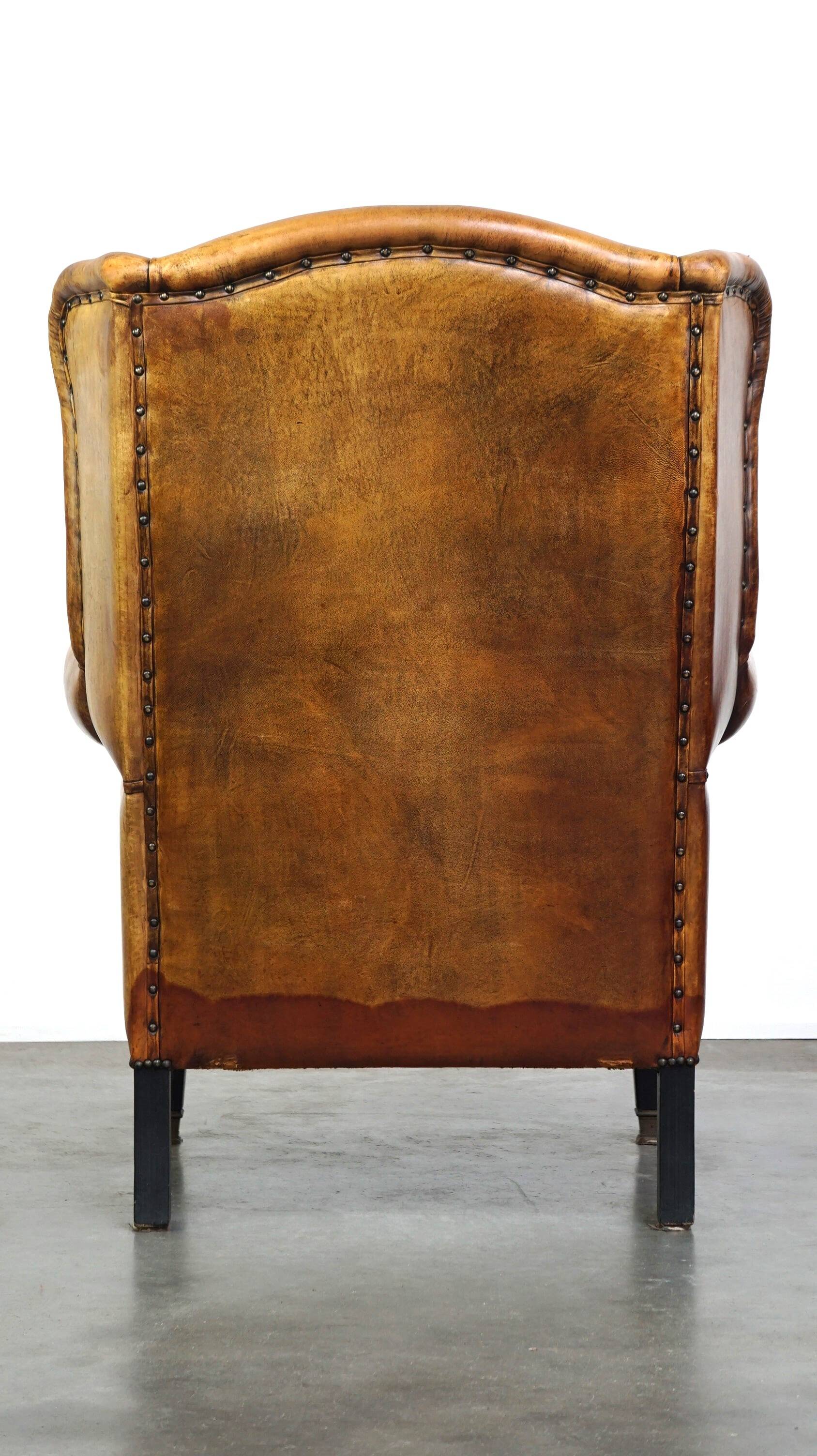Sheepskin leather chair with a beautiful patina