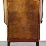 Sheepskin leather chair with a beautiful patina