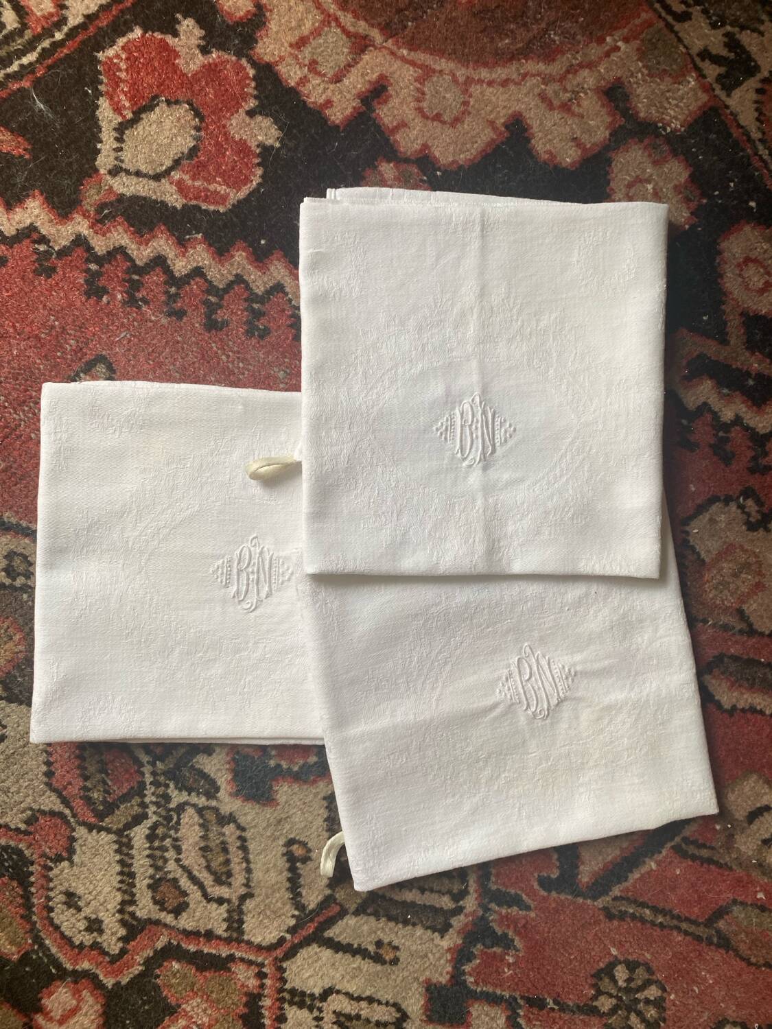 3 white tea towels in damask cotton thread with BN monogram.