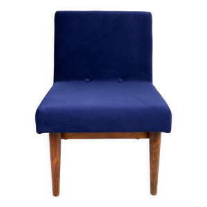 Fauteuil en velours bleu foncé,