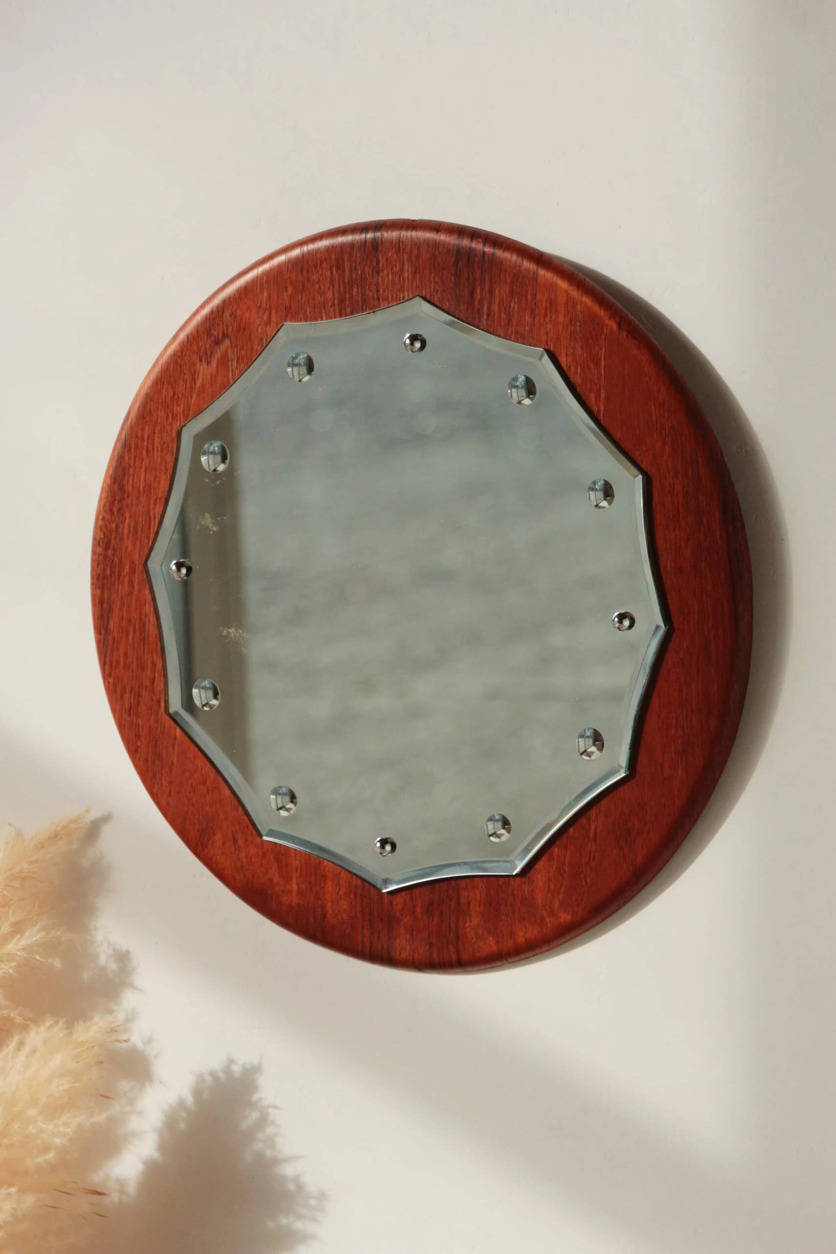 Vintage round teak mirror from the 1960s.