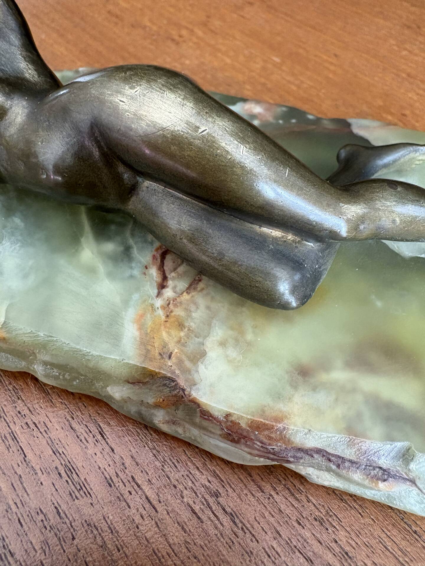 Art Deco female sculpture in bronze with onyx base.