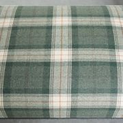 Antique daybed reupholstered with sheepskin and Scottish tartan wool
