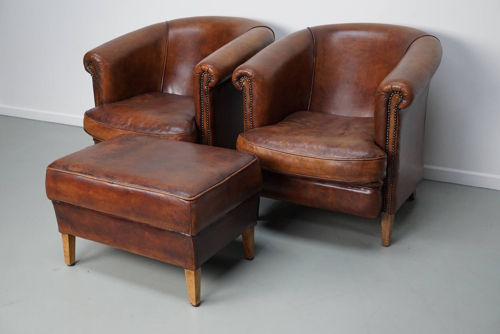 Vintage Dutch cognac coloured leather club chair, set of 2 with footstool